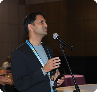 Attendee seated in conference hall
